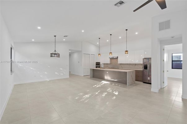 Interior, Kitchen, Marble Walls, Pendant Lights, Recessed Lighting, Stainless Steel Appliances