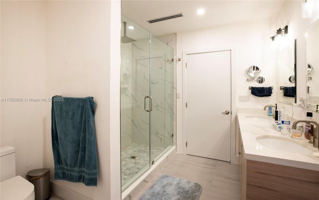 Bathroom, Dual Sink Vanities, Glass Shower, Interior, Marble Walls, Recessed Lighting