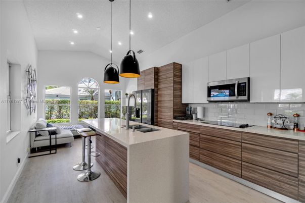Interior, Kitchen, Pendant Lights, Recessed Lighting, Stainless Steel Appliances, Wood Texture Flooring