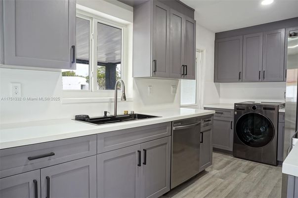 Interior, Kitchen, Recessed Lighting, Washer, Wood Texture Flooring