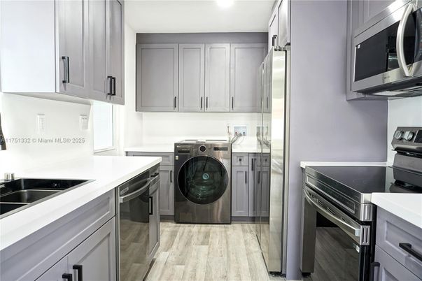 Interior, Kitchen, Recessed Lighting, Stainless Steel Appliances, Washer, Wood Texture Flooring