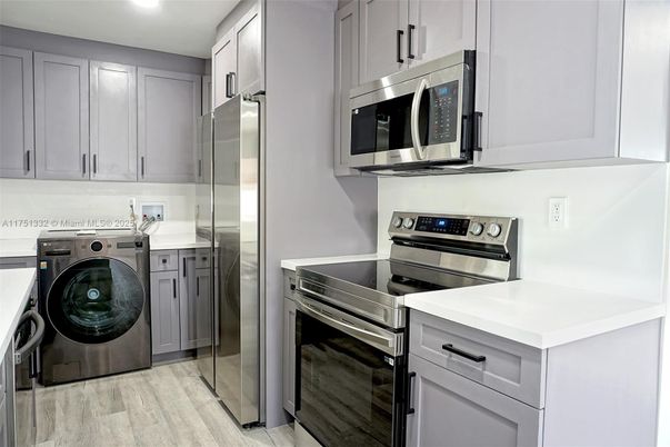 Interior, Kitchen, Recessed Lighting, Stainless Steel Appliances, Washer, Wood Texture Flooring