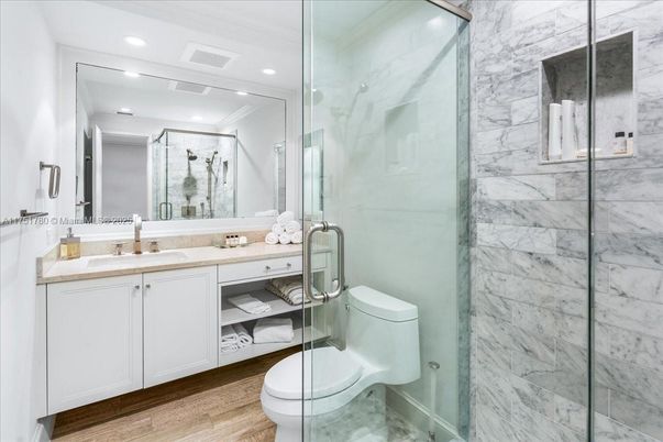 Bathroom, Glass Shower, Interior, Marble Walls, Recessed Lighting, Wood Texture Flooring
