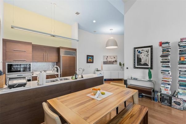 Dining room, Interior, Kitchen, Pendant Lights, Recessed Lighting, Stainless Steel Appliances, Wood Texture Flooring