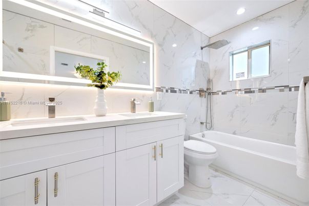 Bathroom, Dual Sink Vanities, Interior, Marble, Marble Walls, Recessed Lighting