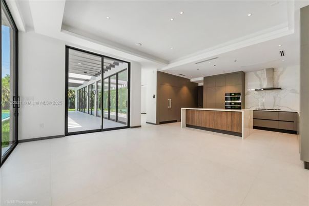 Interior, Kitchen, Marble Walls, Recessed Lighting, Stainless Steel Appliances