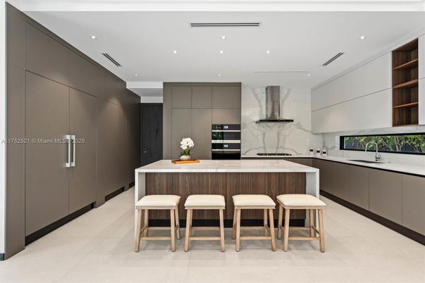 Interior, Kitchen, Marble Walls, Recessed Lighting, Stainless Steel Appliances