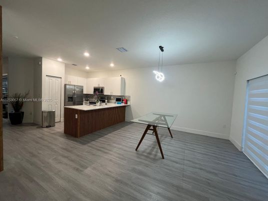 Dining room, Interior, Kitchen, Pendant Lights, Recessed Lighting, Stainless Steel Appliances, Wood Texture Flooring