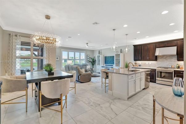 Chandelier, Dining room, Interior, Kitchen, Living room, Marble, Pendant Lights, Recessed Lighting, Stainless Steel Appliances