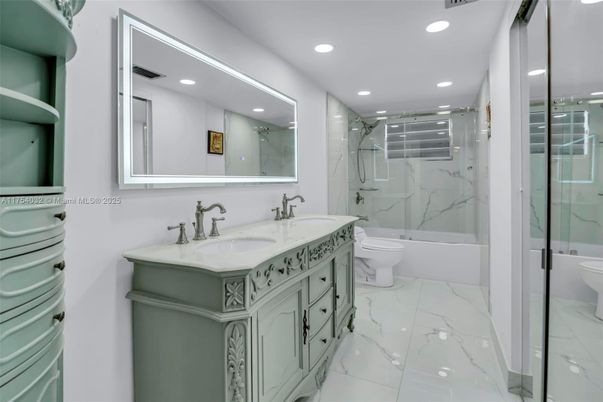 Bathroom, Dual Sink Vanities, Glass Shower, Interior, Marble, Marble Walls, Recessed Lighting