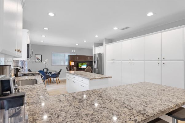Dining room, Interior, Kitchen, Recessed Lighting, Stainless Steel Appliances, Wood Texture Flooring