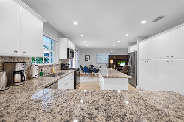 Dining room, Interior, Kitchen, Recessed Lighting, Stainless Steel Appliances, Wood Texture Flooring