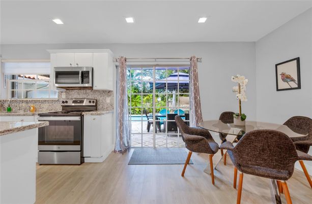 Dining room, Interior, Kitchen, Recessed Lighting, Stainless Steel Appliances, Wood Texture Flooring
