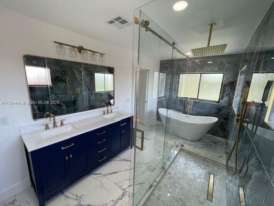 Bathroom, Dual Sink Vanities, Free Standing Baths, Glass Shower, Interior, Marble, Marble Walls, Recessed Lighting