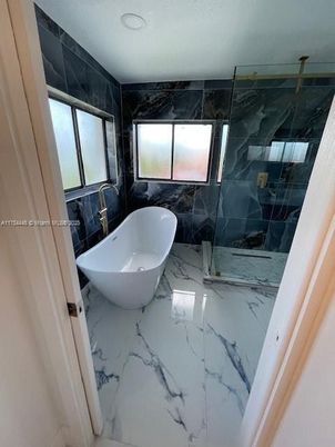 Bathroom, Free Standing Baths, Glass Shower, Interior, Marble, Marble Walls, Recessed Lighting