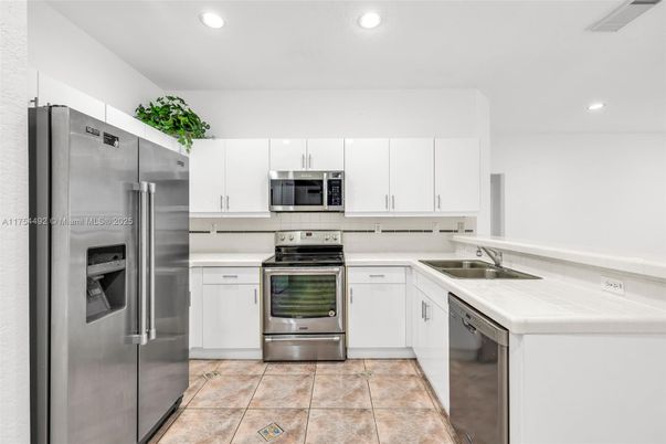 Interior, Kitchen, Recessed Lighting, Stainless Steel Appliances, Tile Countertops