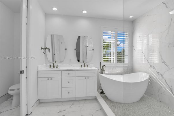 Bathroom, Dual Sink Vanities, Free Standing Baths, Interior, Marble, Marble Walls, Recessed Lighting