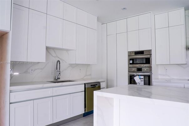 Interior, Kitchen, Marble Walls, Recessed Lighting, Stainless Steel Appliances