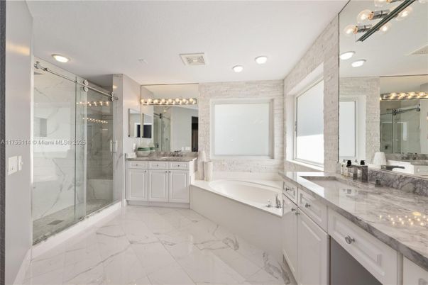 Bathroom, Dual Sink Vanities, Glass Shower, Interior, Marble, Marble Walls, Recessed Lighting