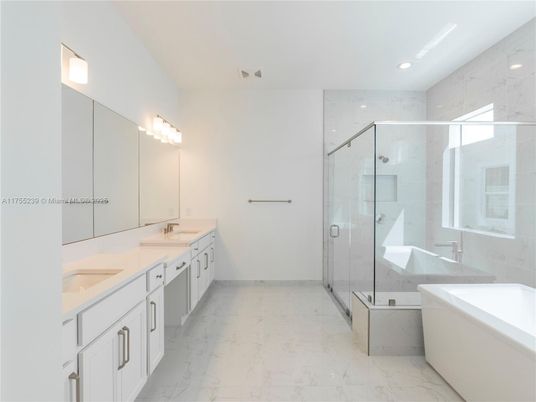 Bathroom, Dual Sink Vanities, Free Standing Baths, Glass Shower, Interior, Marble, Marble Walls, Recessed Lighting