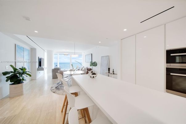 Dining room, Interior, Kitchen, Living room, Pendant Lights, Recessed Lighting, Stainless Steel Appliances, Water, Wood Texture Flooring