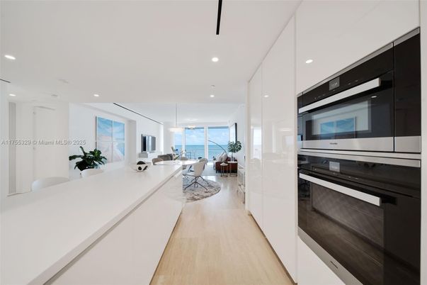 Dining room, Interior, Kitchen, Living room, Pendant Lights, Recessed Lighting, Stainless Steel Appliances, Water, Wood Texture Flooring