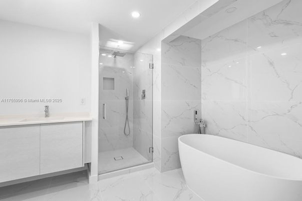 Bathroom, Free Standing Baths, Glass Shower, Interior, Marble, Marble Walls, Recessed Lighting