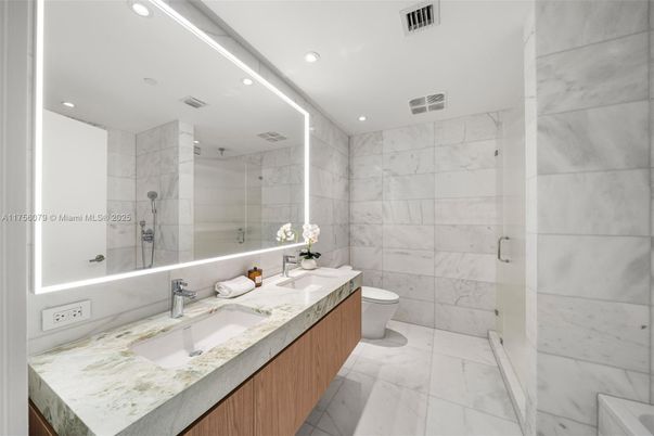Bathroom, Dual Sink Vanities, Glass Shower, Interior, Marble, Marble Walls, Recessed Lighting