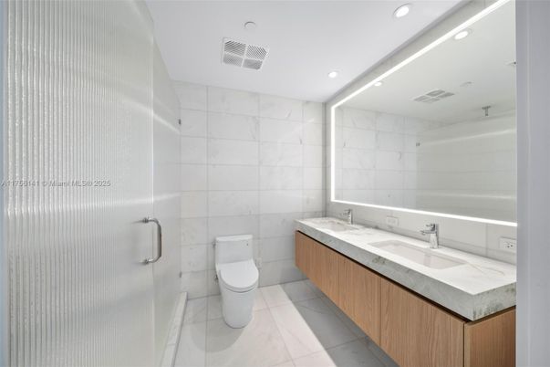 Bathroom, Dual Sink Vanities, Glass Shower, Interior, Marble, Marble Walls, Recessed Lighting