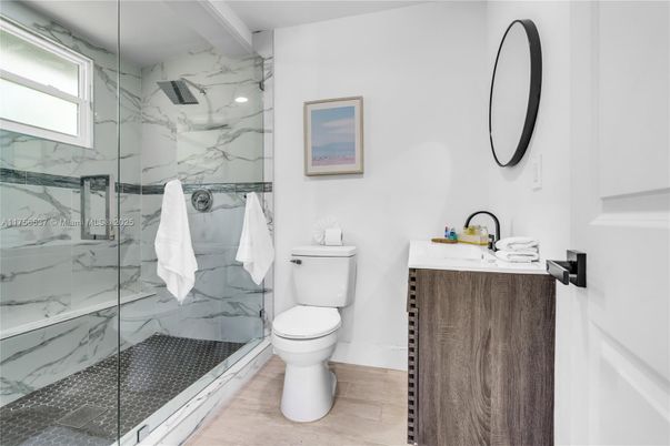 Bathroom, Glass Shower, Interior, Marble Walls, Wood Texture Flooring