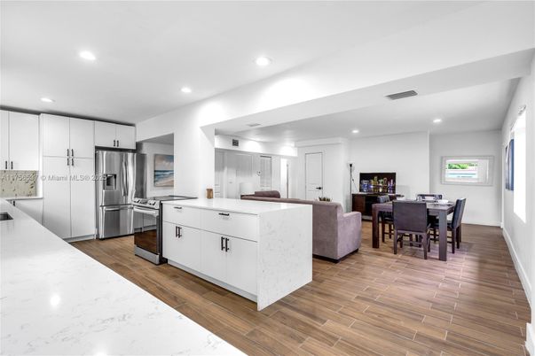 Dining room, Interior, Kitchen, Recessed Lighting, Stainless Steel Appliances, Wood Texture Flooring