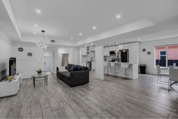 Dining room, Interior, Kitchen, Living room, Pendant Lights, Recessed Lighting, Stainless Steel Appliances, Wood Texture Flooring