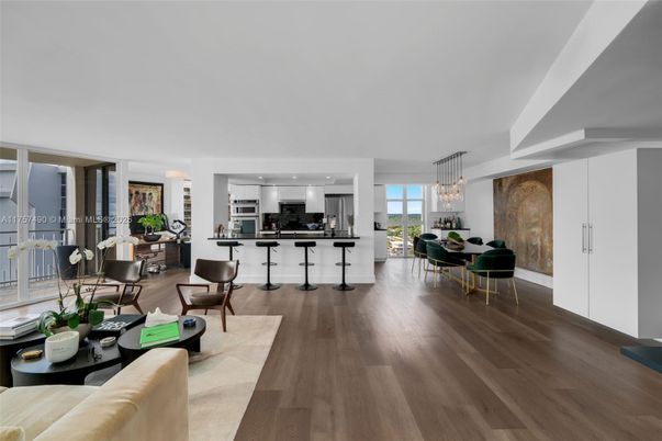 Chandelier, Dining room, Interior, Kitchen, Living room, Pendant Lights, Recessed Lighting, Stainless Steel Appliances, Wood Texture Flooring