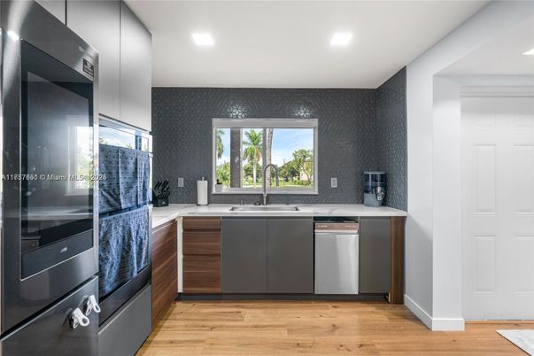 Interior, Kitchen, Recessed Lighting, Stainless Steel Appliances, Wood Texture Flooring