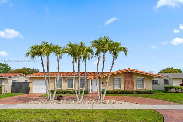 Attached, Backyard, Exterior, Facade, Brick Facade, Spanish Mediterranean