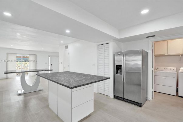 Interior, Kitchen, Recessed Lighting, Stainless Steel Appliances, Washer, Wood Texture Flooring