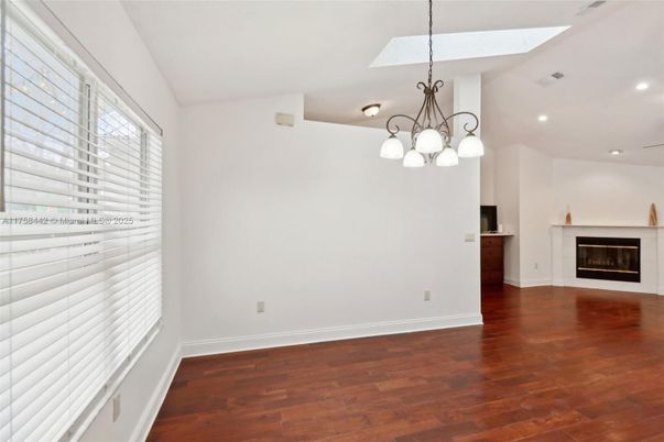 Chandelier, Empty room, Fireplace, Interior, Pendant Lights, Recessed Lighting, Wood Texture Flooring
