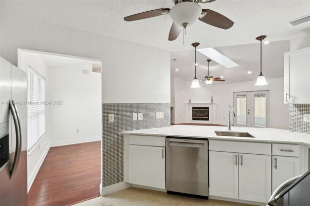 Fireplace, Interior, Kitchen, Pendant Lights, Recessed Lighting, Stainless Steel Appliances, Wood Texture Flooring