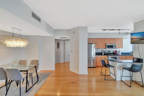 Chandelier, Dining room, Interior, Kitchen, Pendant Lights, Stainless Steel Appliances, Wood Texture Flooring