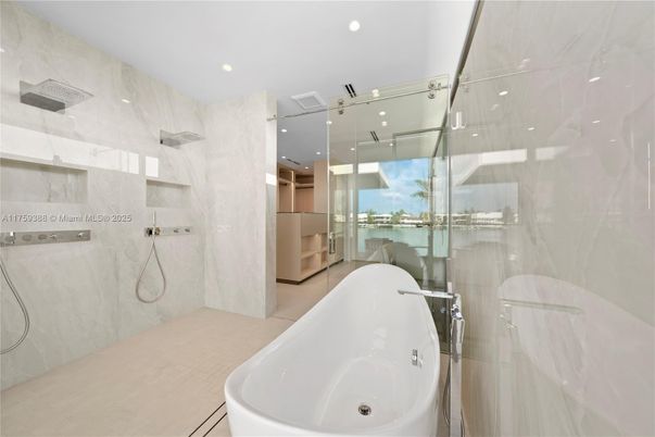 Bathroom, Free Standing Baths, Glass Shower, Interior, Marble Walls, Recessed Lighting, Water