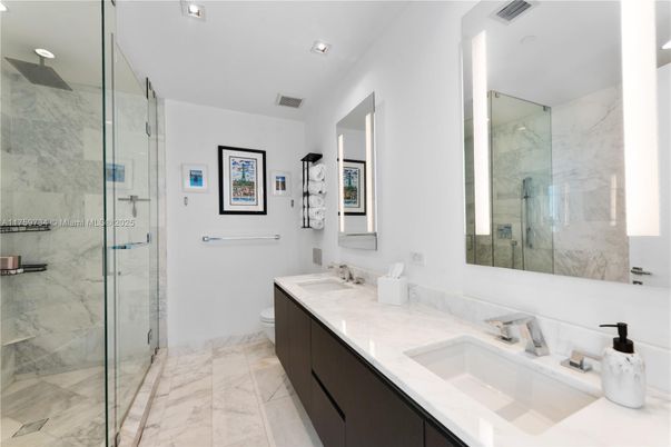 Bathroom, Dual Sink Vanities, Glass Shower, Interior, Marble, Marble Walls, Recessed Lighting
