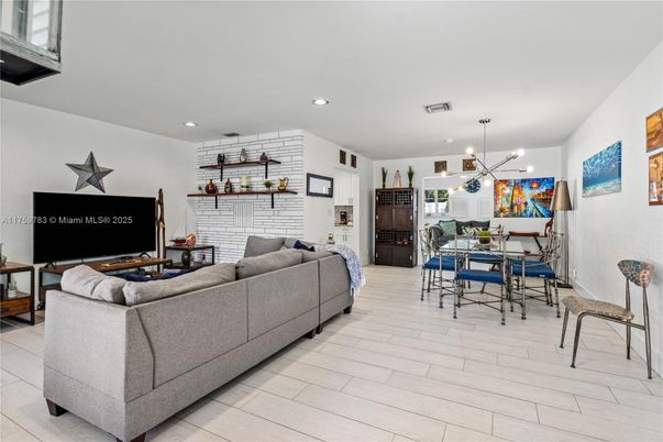 Dining room, Fireplace, Interior, Living room, Pendant Lights, Recessed Lighting, Stone Walls, Wood Texture Flooring