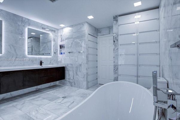 Bathroom, Dual Sink Vanities, Free Standing Baths, Interior, Marble, Marble Walls, Recessed Lighting