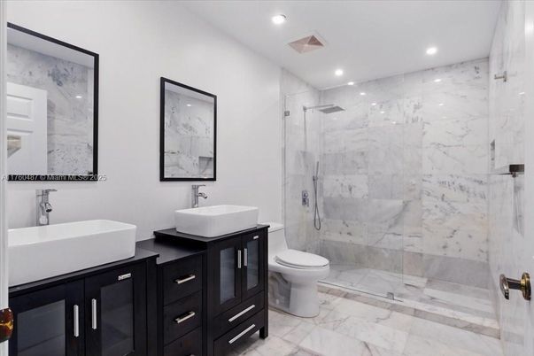 Bathroom, Dual Sink Vanities, Glass Shower, Interior, Marble, Marble Walls, Recessed Lighting