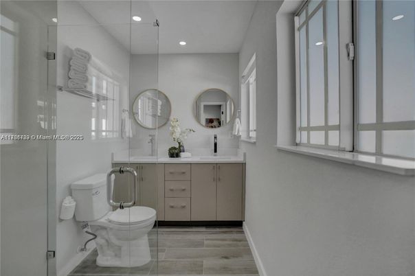 Bathroom, Dual Sink Vanities, Glass Shower, Interior, Recessed Lighting, Wood Texture Flooring
