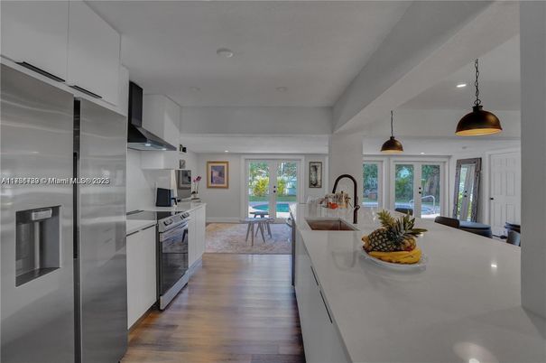 Dining room, Interior, Kitchen, Pendant Lights, Recessed Lighting, Stainless Steel Appliances, Wood Texture Flooring