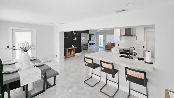 Interior, Kitchen, Marble Walls, Recessed Lighting, Stainless Steel Appliances
