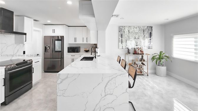 Interior, Kitchen, Marble Walls, Recessed Lighting, Stainless Steel Appliances