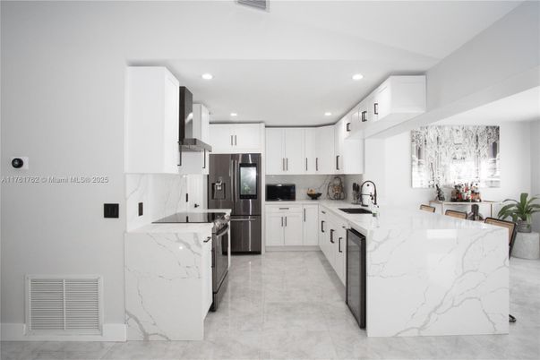 Interior, Kitchen, Marble Walls, Recessed Lighting, Stainless Steel Appliances