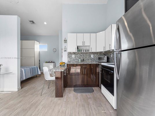 Dining room, Interior, Kitchen, Recessed Lighting, Stainless Steel Appliances, Wood Texture Flooring